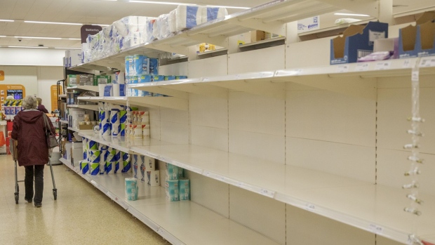 Empty shelves stand in the toilet paper aisle at a J Sainsbury Plc supermarket in Exeter, U.K. on March 6. Photographer: Luke MacGregor/Bloomberg