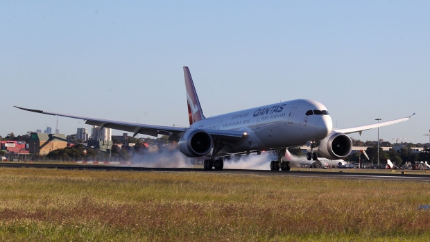 SYDNEY, AUSTRALIA - OCTOBER 20: Qantas flight 7879 lands at Sydney Airport after flying 19 hours and 16 minutes from New York to Sydney on October 20, 2019 in Sydney, Australia. Qantas is the first commercial airline to ever fly direct from New York to Sydney. The flight was restricted to 40 people plus 10 crew to increase aircraft range, and included medical scientists and health experts on board to conduct studies in the cockpit and the cabin to help determine strategies to promote long haul inflight health and wellbeing on ultra-long haul flights. It comes as the national carrier continues to work towards the final frontier of global aviation by launching non-stop commercial flights between the US and the UK to the east coast of Australia in an ambitious project dubbed "Project Sunrise". (Photo by James D. Morgan/Getty Images for Qantas)