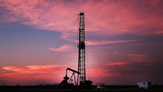 MIDLAND, TX - FEBRUARY 05: An oil drill is viewed near a construction site for homes and office buildings on February 5, 2015 in Midland, Texas.