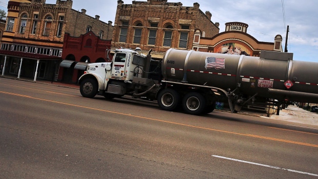 CUERO, TX - MARCH 26: Trucks serving the oil industry pass through the town of Cuero, Texas on March 26, 2015 in Cuero, Texas. Texas, which in just the last five years has tripled its oil production and delivered hundreds of billions of dollars into the economy, is looking at what could be a sustained downturn in prices. Crude oil prices today are almost 60 percent lower than they were six months ago.While the Texan economy has become more diversified over the years, oil is still the states largest monetary generator and any sustained downturn would be devastating for employment and the economy. Outplacement firm Challenger, Gray & Christmas this month said a drop in oil prices have been responsible for 39,621 job cuts in the first two months of the year. (Photo by Spencer Platt/Getty Images) Photographer: Spencer Platt/Getty Images North America