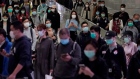 People wear face masks as a precaution against the COVID-19 illness in Hong Kong 