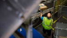An employee collects a package from a conveyor at the Amazon.com Inc. fulfillment center in Robbinsville, New Jersey, U.S., on Thursday, June 7, 2018. Seattle-based Amazon hasn't yet announced the exact date for this year's Amazon Prime Day, the e-commerce giant’s big July sales promotion. Photographer: Bess Adler/Bloomberg