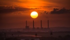 The sun sets over El Palito oil refinery in Puerto Cabello, Venezuela, on Monday, Aug. 24, 2015.