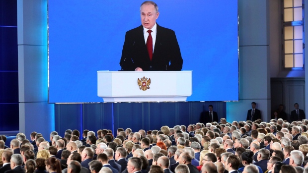 Vladimir Putin speaks during his annual state of the nation address in Moscow. Photographer: Andrey Rudakov/Bloomberg