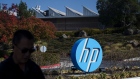 A pedestrian walks past HP Inc. headquarters in Palo Alto, California, U.S., on Thursday, Nov. 7, 2019. HP's board is still deliberating over a $33 billion takeover proposal from Xerox Holdings Corp., people familiar with the matter said, adding uncertainty to a potential blockbuster deal that would reshape the printing industry. Photographer: David Paul Morris/Bloomberg