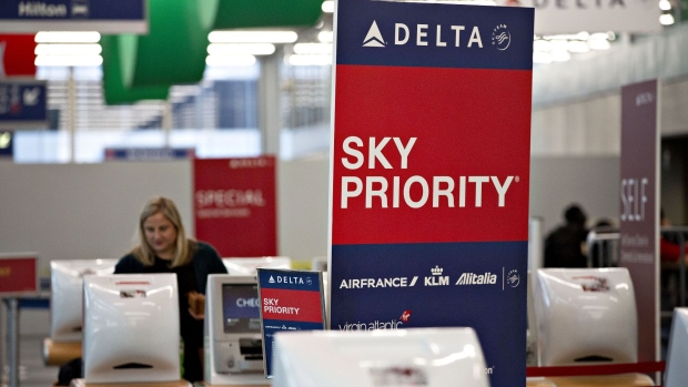 A Sky Priority sign is displayed near a Delta Air Lines Inc. check-in counter at O'Hare International Airport (ORD) in Chicago, Illinois, U.S., on Tuesday, Jan. 8, 2019. Delta Air Lines is scheduled to report earnings on January 15. Photographer: Daniel Acker/Bloomberg