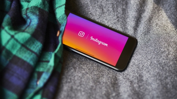 Facebook Inc. Instagram signage is displayed on an Apple Inc. iPhone in an arranged photograph taken in the Brooklyn Borough of New York, U.S., on Sunday, Jan. 26, 2020. Facebook Inc. is scheduled to release earnings figures on January 29. Photographer: Gabby Jones/Bloomberg