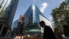 A pedestrian passes the new European headquarters of Goldman Sachs Group Inc. in London, U.K. Photographer: Simon Dawson/Bloomberg