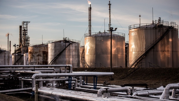 Storage tanks stand in the Duna oil refinery, operated by MOL Hungarian Oil & Gas Plc, in Szazhalombatta, Hungary, on Monday, Feb. 13, 2019. Oil traded near a three-month high as output curbs by OPEC tightened global supply while trade talks between the U.S. and China lifted financial markets. Photographer: Akos Stiller/Bloomberg