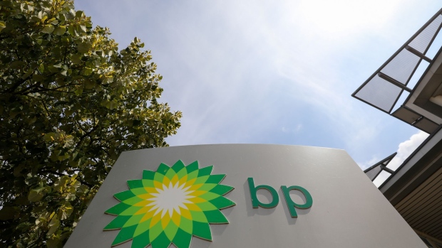 A logo stands outside BP Plc's International Centre for Business & Technology (ICBT) in Sunbury on Thames, U.K., on Thursday, July 19, 2018. Bernard Looney, BP's upstream chief executive officer, suggests much of the recent cost reductions have to do with tech's increasing ability to let them do more for less. Photographer: Simon Dawson/Bloomberg