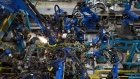 Sparks fly as robotic arms perform inner frame welds for 2018 Honda Accord vehicles during production at the Honda of America Manufacturing Inc. Marysville Auto Plant in Marysville, Ohio, U.S., on Thursday, Dec. 21, 2017. More than three decades after Honda Motor Co. first built an Accord sedan at its Marysville factory in 1982, humans are still an integral part of the assembly process -- and that's unlikely to change anytime soon. Photographer: Ty Wright/Bloomberg