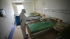 A worker disinfects a room at the Red Cross hospital in Wuhan, on March 18.