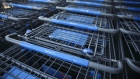 The Wal-Mart Stores Inc. logo is displayed on shopping carts outside the company's location in Burbank, California, U.S., on Tuesday, Nov. 22, 2016. Consumer hardline retailers are hopeful Black Friday will provide a strong start to the holiday shopping season, but any lift may come at the expense of margins, as the landscape has become increasingly promotional. Photographer: Patrick T. Fallon/Bloomberg