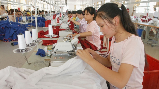 WUHU, CHINA - JUNE 4: (CHINA OUT; PHOTOCOME OUT) Seamstresses work at a garment factory on June 4, 2005 in Wuhu of Anhui Province, China. US Commerce Secretary Carlos Gutierrez met with China's Commerce Minister Bo Xilai on June 4 for talks focusing on a growing dispute about surging Chinese textile imports. Bo said moves by the European Union and United States to impose limits on Chinese textile exports were wrong and had no basis. (Photo by China Photos/Getty Images)