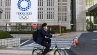 A cyclist passes banners for the Tokyo 2020 Olympic and Paralympic Games on March 24. Photographer: Noriko Hayashi/Bloomberg