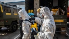 Members of Spain's military emergencies unit (UME) prepare to undertake a deep clean operation at the border inspection point at the Port of Barcelona in Barcelona, Spain, on Friday, March 20, 2020. The novel coronavirus has claimed 235 lives in Spain over the past 24 hours as the death toll surged past 1,000 almost a week into a nationwide lockdown. Photographer: Angel Garcia/Bloomberg