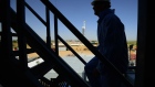 The silhouette of a contractor is seen walking up stairs at an Anadarko Petroleum Corp. oil rig site in Fort Lupton, Colorado, U.S., on Tuesday, Aug. 12, 2014. Photographer: Jamie Schwaberow