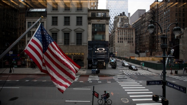 A cyclist rides down Fifth Avenue in New York on March 19. Photographer: Michael Nagle/Bloomberg