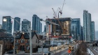 A residential building stands under construction in downtown Toronto, Ontario, Canada, on Sunday, Feb. 16, 2020. A shrinking supply of available homes for sale in Canada's largest city continued to drive prices higher last month, bringing annual increases to the strongest in more than two years. Photographer: Brett Gundlock/Bloomberg