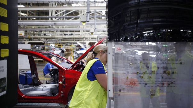 A worker views an implementation map at the Toyota Motor Corp. manufacturing plant in Georgetown, Kentucky, U.S., on Thursday, Aug. 29, 2019. Retrofitting a Camry sedan assembly line for the RAV4 SUV is part of a company mandate to update Toyota's oldest North American plant with newer technology, more efficient processes, and fresher products. Photographer: Luke Sharrett/Bloomberg