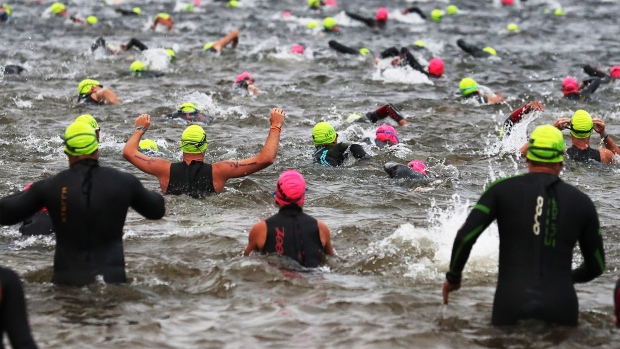 Athletes take to the water for the start of the Subaru IRONMAN in Mont Tremblant, Canada in 2019.
