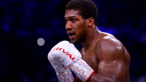 DIRIYAH, SAUDI ARABIA - DECEMBER 07: Anthony Joshua looks on with a cut to his left eye during the IBF, WBA, WBO & IBO World Heavyweight Title Fight between Andy Ruiz Jr and Anthony Joshua during the Matchroom Boxing 'Clash on the Dunes' show at the Diriyah Season on December 07, 2019 in Diriyah, Saudi Arabia (Photo by Richard Heathcote/Getty Images)