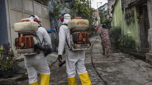 Workers disinfect a street surrounding a hospital in Niteroi, Brazil. Photographer: Dado Galdieri/Bloomberg