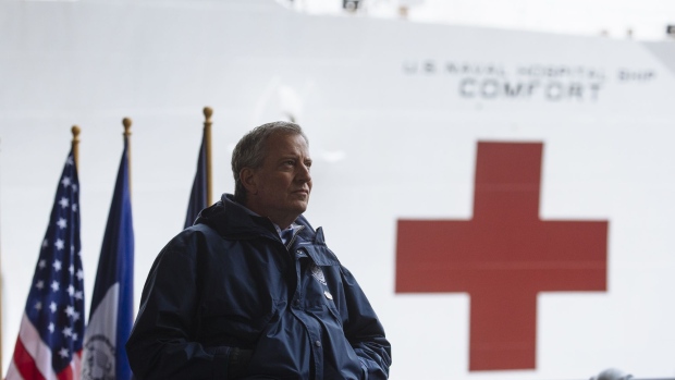 Bill de Blasio sits at a news conference as the USNS Comfort hospital ship arrives at Pier 90 in New York on March 30. Photographer: Angus Mordant/Bloomberg