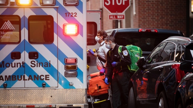 Medical workers in a Monut Sinai ambulance respond to a call in the Financial District of New York, U.S., on Monday, March 30, 2020. Roughly 37,500 people have tested positive for the coronavirus in New York City, officials said on Monday, up about 3,700 from a day earlier. Photographer: Michael Nagle/Bloomberg