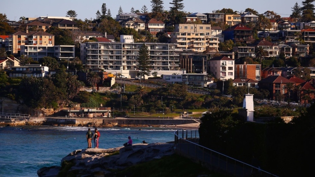 Residential buildings stand along the coastline near Bondi Beach in Sydney, Australia, on Wednesday, May 15, 2019. Australia's economy has been weighed down by a retrenchment in household spending as property prices slump and slash personal wealth. An election Saturday is likely to see the opposition Labor party win power and lift spending further. Photographer: David Gray/Bloomberg