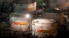 Lights illuminate oil storage tanks at night at the RN-Tuapsinsky refinery, operated by Rosneft Oil Co., in Tuapse, Russia, on Sunday, March 22, 2020. Major oil currencies have fallen much more this month following the plunge in Brent crude prices to less than $30 a barrel, with Russia’s ruble down by 15%. Photographer: Andrey Rudakov/Bloomberg