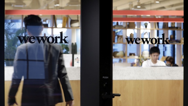 The WeWork logo is displayed on a glass door of the entrance to the WeWork Ocean Gate Minatomirai co-working office space, operated by The We Company, in Yokohama, Japan. Photographer: Kiyoshi Ota/Bloomberg