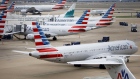 American Airlines Group Inc. planes stand at Dallas-Fort Worth International Airport (DFW) in Grapevine, Texas, U.S., on Friday, April 6, 2018. Photographer: Patrick T. Fallon/Bloomberg
