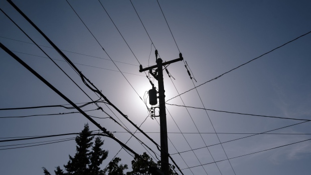 Power lines stand silhouetted in Walnut Creek, California, U.S., on Friday, Oct. 11, 2019. Californians are emerging from an unprecedented blackout that plunged millions into darkness this week as utility giant PG&E Corp. tried to keep its power lines from igniting catastrophic wildfires. Photographer: Michael Short/Bloomberg