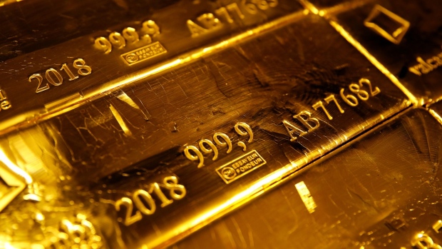 A mark of 999.9 fine sits on hallmarked 12.5 kilogram gold bullion bars stacked at the Valcambi SA precious metal refinery in Lugano, Switzerland, on Monday, April 24, 2018. Gold's haven qualities have come back in focus this year as President Donald Trumps administration picks a series of trade fights with friends and foes, and investors fret about equity market wobbles that started on Wall Street and echoed around the world. Photographer: Bloomberg/Bloomberg