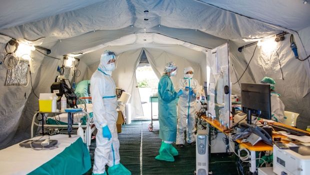 Medical personnel work inside a triage tent at a hospital in Brescia, Italy on March 13.