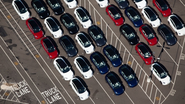 Vehicles sit parked outside of the Tesla Inc. assembly plant in this aerial photograph taken above Fremont, California, U.S.