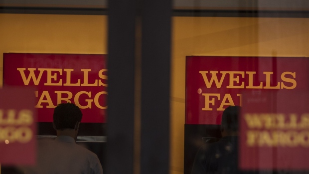 Customers use automatic teller machines (ATM) inside a Wells Fargo & Co. bank branch in New York, U.S., on Tuesday, July 2, 2019. Wells Fargo & Co. is scheduled to release earnings figures on July 16. Photographer: Victor J. Blue/Bloomberg