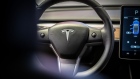 A sits on the steering wheel of a Tesla Inc. Model 3 electric vehicle in the Tesla store in Barcelona, Spain, on Thursday, July 11, 2019. Tesla is poised to increase production at its California car plant and is back in hiring mode, according to an internal email sent days after the company wrapped up a record quarter of deliveries. Photographer: Angel Garcia/Bloomberg