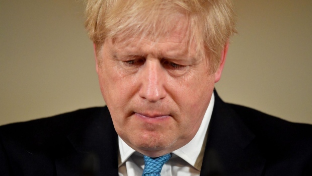 Boris Johnson, U.K. prime minister, reacts during a daily coronavirus briefing inside number 10 Downing Street in London, U.K., on Thursday, March 19, 2020. Johnson said the U.K. can "turn the tide" on its burgeoning coronavirus outbreak within three months, as he said ministers will unveil measures to protect businesses and workers from the crisis.