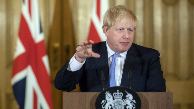 Boris Johnson, U.K. prime minister, gestures as he speaks during a news conference inside number 10 Downing Street in London, U.K., on Monday, March 9, 2020. Johnson's spokesman said both the government and Bank of England are ready to take action to bolster the economy if needed. Photographer: Bloomberg/Bloomberg