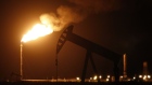 Aflare at night in the oil fields surrounding Midland, Texas. Photographer: Luke Sharrett/Bloomberg