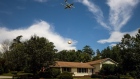 An Alphabet Wing drone delivers a package at a home during a demonstration in Blacksburg, Virginia. Photographer: Charles Mostoller/Bloomberg