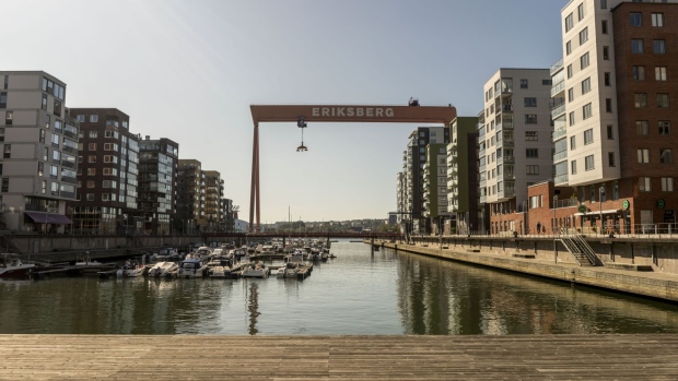 The Eriksberg gantry cranes stands among residential developments in the Eriksberg area of Gothenburg, Sweden, on Saturday, Aug. 24, 2019. The Swedish krona climbed against the dollar for the first time in six days last week after a senior Riksbank official said that inflation outcomes looked "pretty good," fueling expectations of a future rate hike. Photographer: Fredrik Lerneryd/Bloomberg