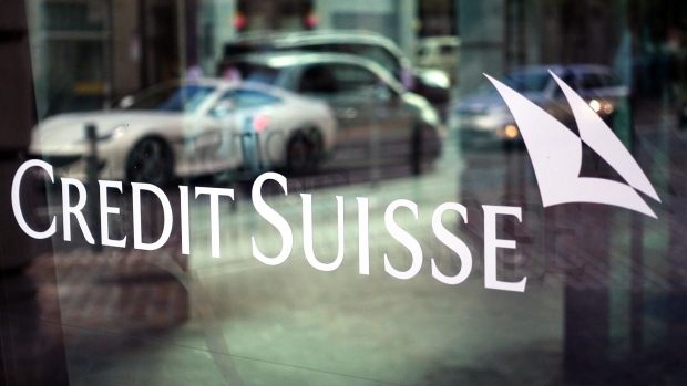 A Credit Suisse logo is displayed on the window of a Credit Suisse Group AG bank branch in Zurich, Switzerland, on Sunday, Sept 29, 2019. Credit Suisse is seeking to draw a line under one of the worst scandals in its recent history after the bank hired a private detective agency to shadow former executive Iqbal Khan because of fears he’d poach employees after moving to UBS Group AG. Photographer: Stephen Kelly/Bloomberg