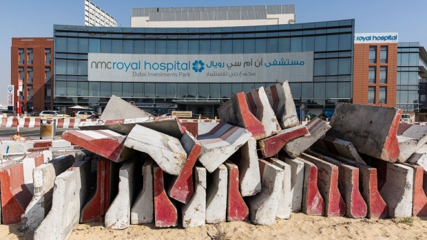 Construction material sit outside the NMC Royal Hospital, operated by NMC Health, in Dubai on March 1. Photographer: Christopher Pike/Bloomberg