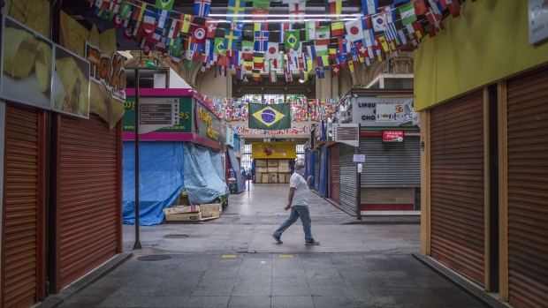 Stores sit closed in the Municipal Market of Sao Paulo on April 8. Photographer: Rodrigo Capote/Bloomberg