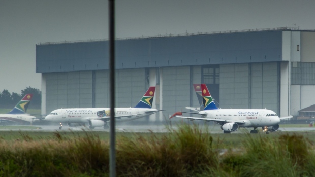 South African Airlines jets at O.R. Tambo International Airport. Photographer: Waldo Swiegers/Bloomberg