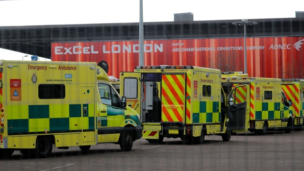 Ambulances wait in the car park at the ExCeL London exhibition centre in London on March 30, 2020 Photographer: Tolga Akmen/AFP via Getty Images