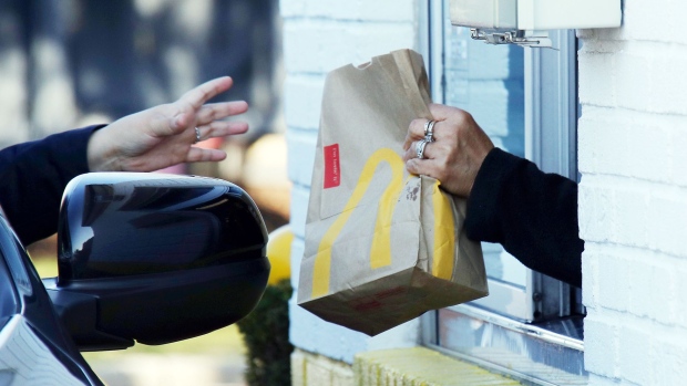 HICKSVILLE, NEW YORK - MARCH 18: A customer at a McDonald's uses the drive up window on March 18, 2020 in Hicksville, New York. The World Health Organization declared COVID-19 a global pandemic on March 11. (Photo by Bruce Bennett/Getty Images)